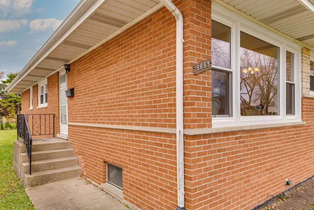 a view of front door of house with stairs