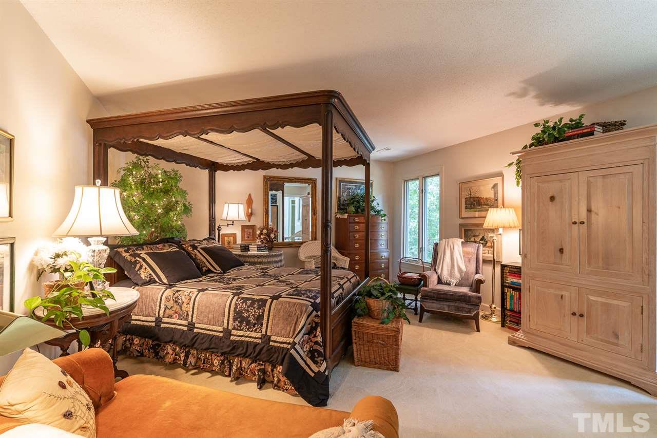 11621 Coachmans Way Raleigh, NC 27614 - Photo 13 of 30 a bedroom with furniture and large windows