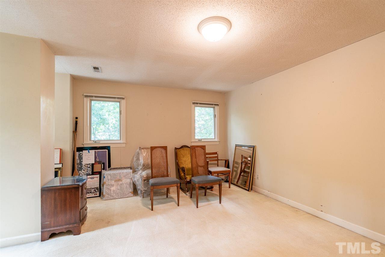 11621 Coachmans Way Raleigh, NC 27614 - Photo 17 of 30 a view of a livingroom with furniture and a window