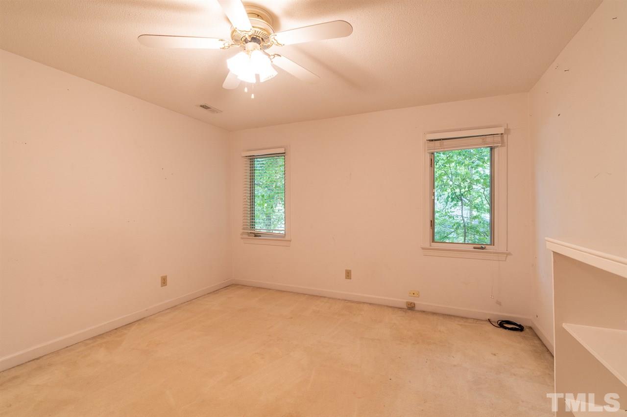 11621 Coachmans Way Raleigh, NC 27614 - Photo 21 of 30 an empty room with windows and fan