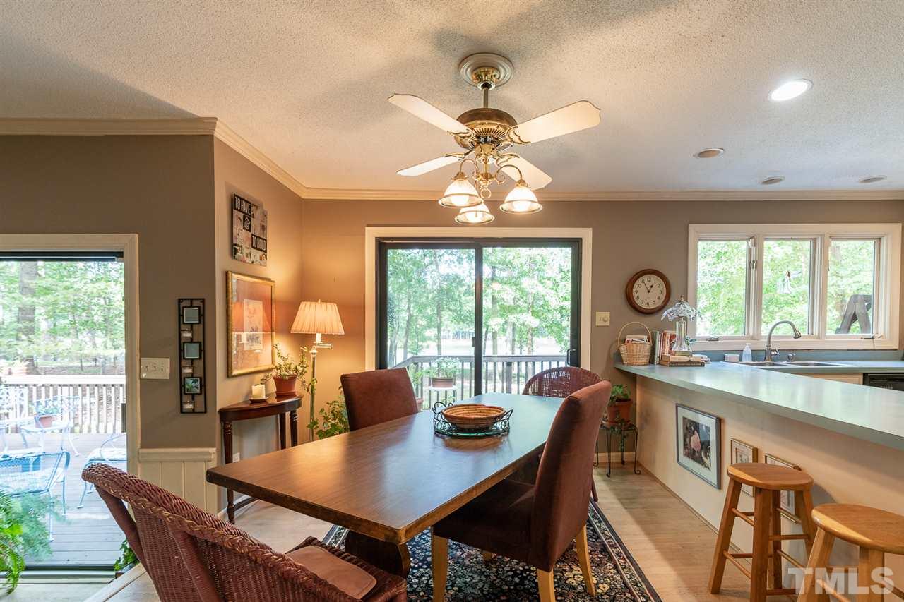 11621 Coachmans Way Raleigh, NC 27614 - Photo 8 of 30 a view of a dining room with furniture window and outside view