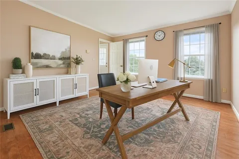 a view of a dining room with furniture and window