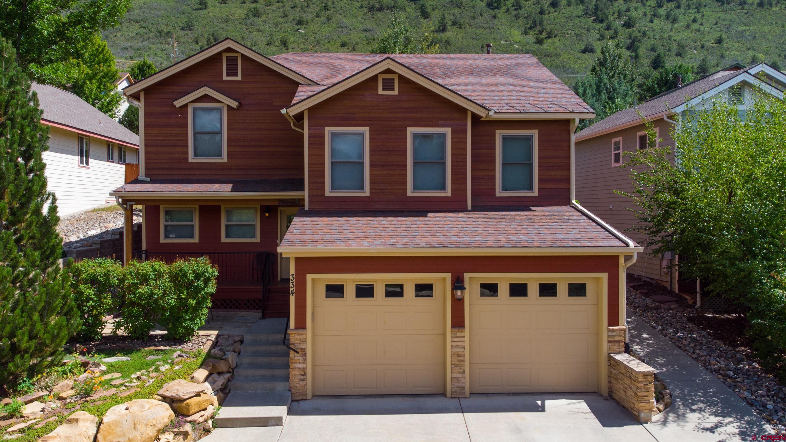 334 Jenkins Ranch Road Durango, CO 81301 - Photo 2 of 35 a front view of a house with yard and trees