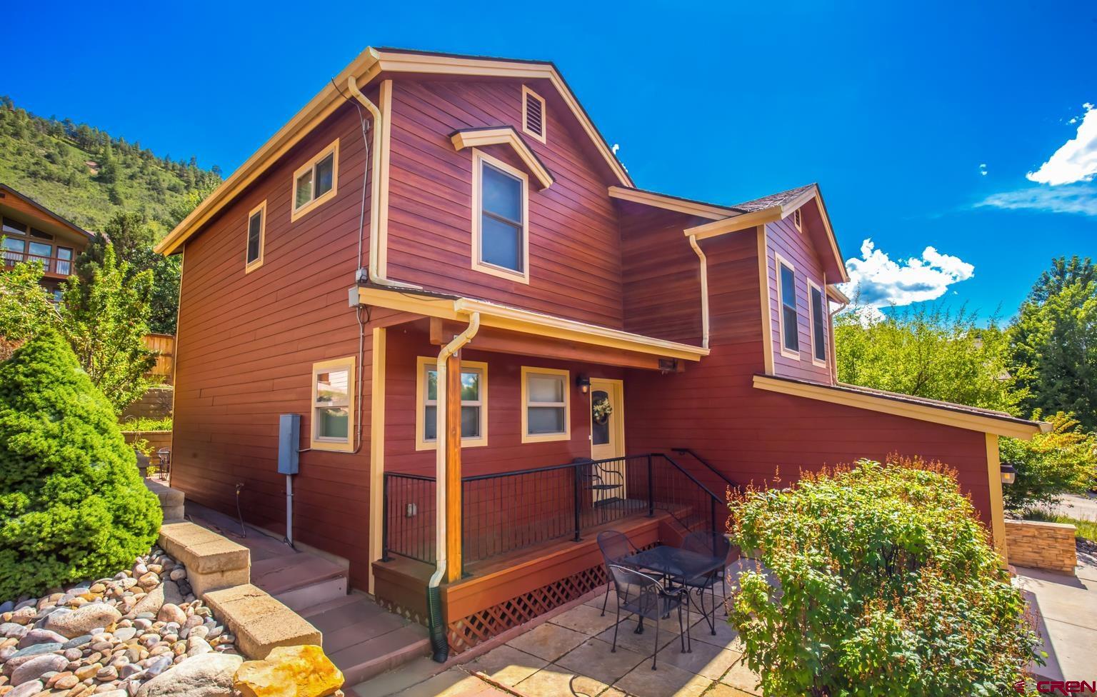 334 Jenkins Ranch Road Durango, CO 81301 - Photo 3 of 35 a front view of a house with a yard