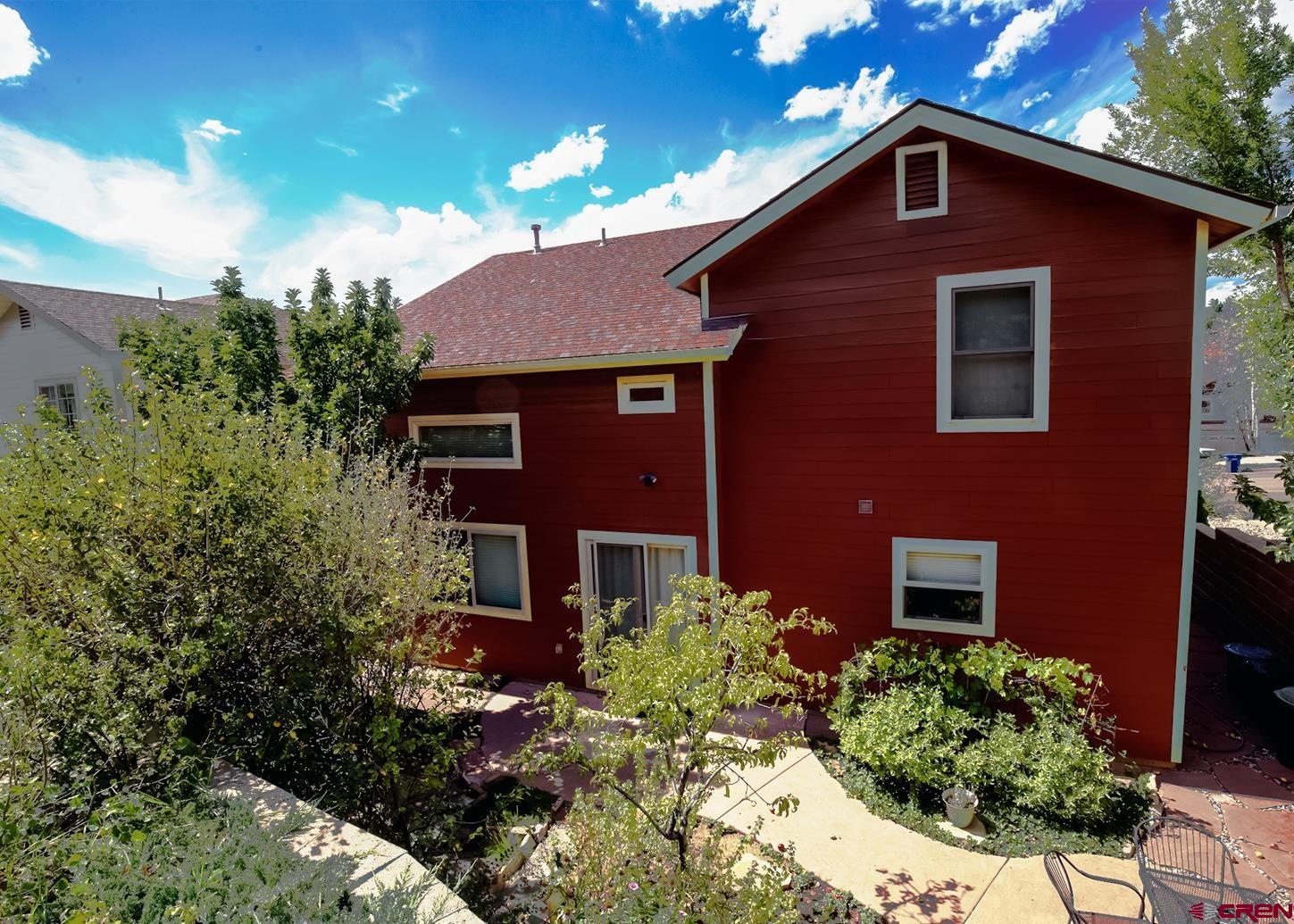334 Jenkins Ranch Road Durango, CO 81301 - Photo 4 of 35 a brick house with a large windows