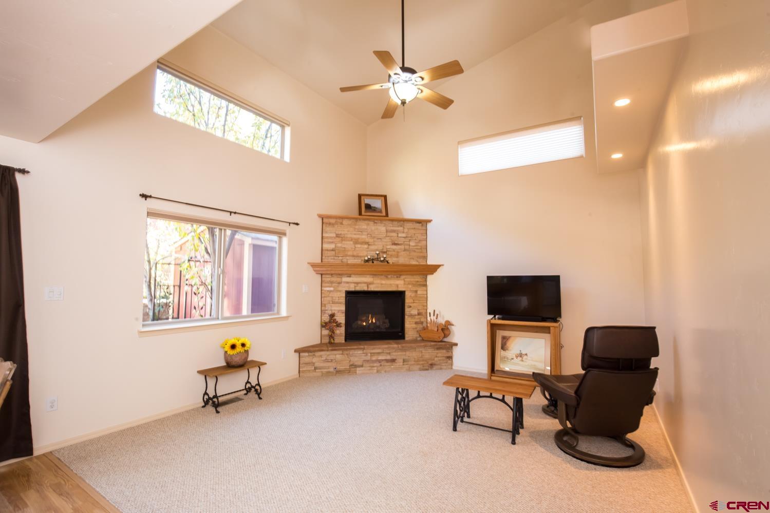 334 Jenkins Ranch Road Durango, CO 81301 - Photo 8 of 35 a living room with furniture and a fireplace