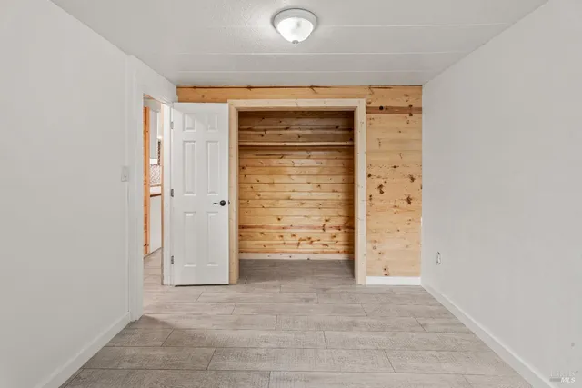 a bathroom with a sink shower and a mirror
