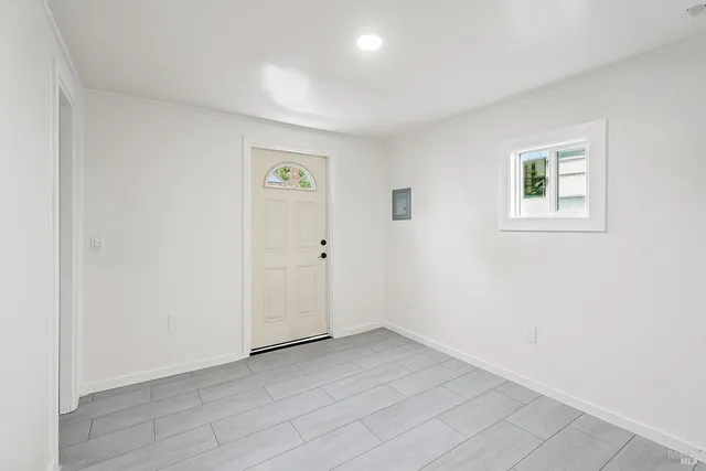 a kitchen with stainless steel appliances kitchen island granite countertop a stove and a refrigerator