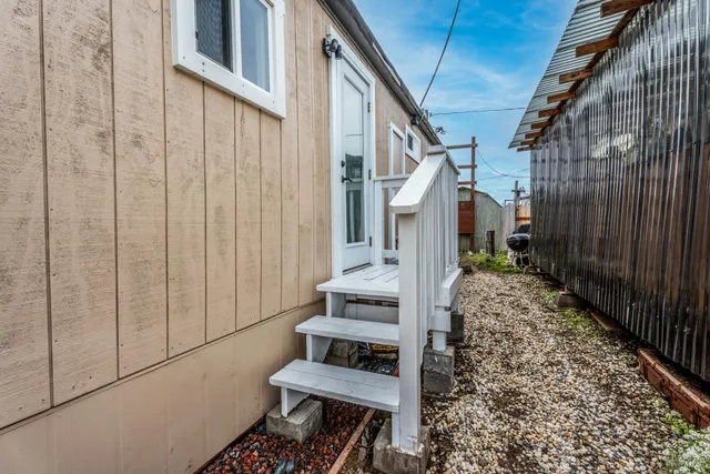 a kitchen with granite countertop a sink and cabinets