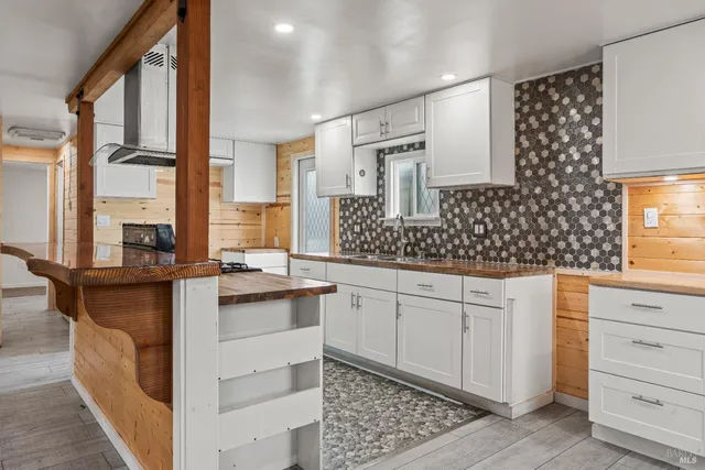 a kitchen with a sink stove and refrigerator