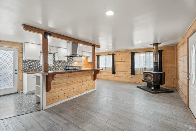 a view of living room with furniture and large window