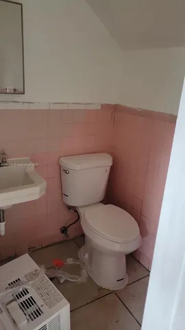a bathroom with a toilet and a sink