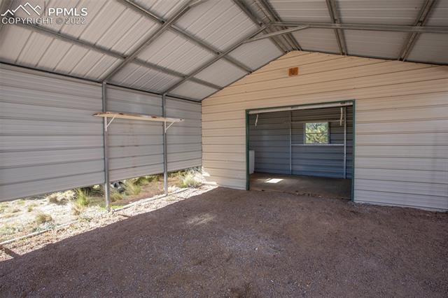 You can easily pull ATVs or motorcycles inside the overhead door.