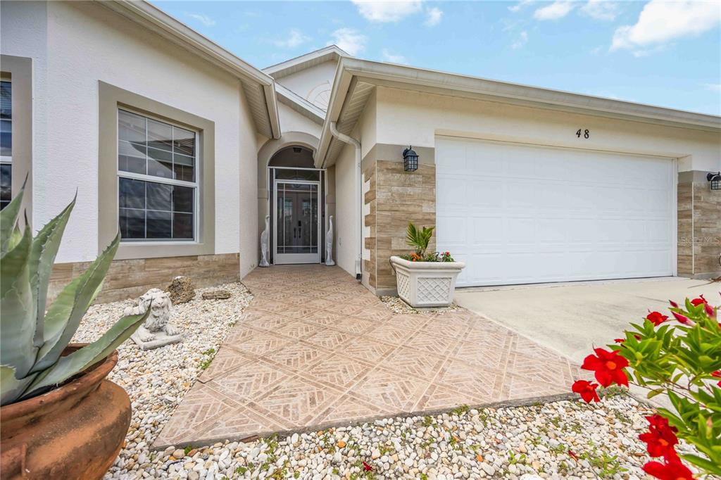 48 Bunker Road Rotonda West, FL 33947 - Photo 5 of 59 a view of a entryway door front of house