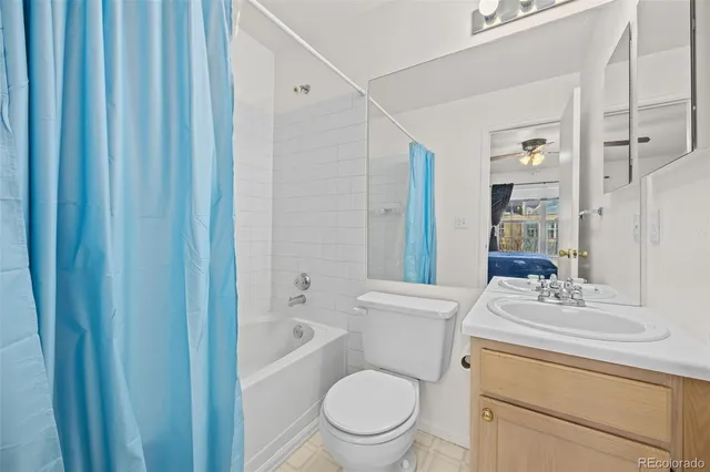 a white toilet sitting next to a bathroom sink