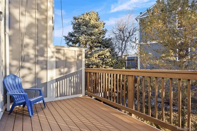 a view of a balcony with wooden floor