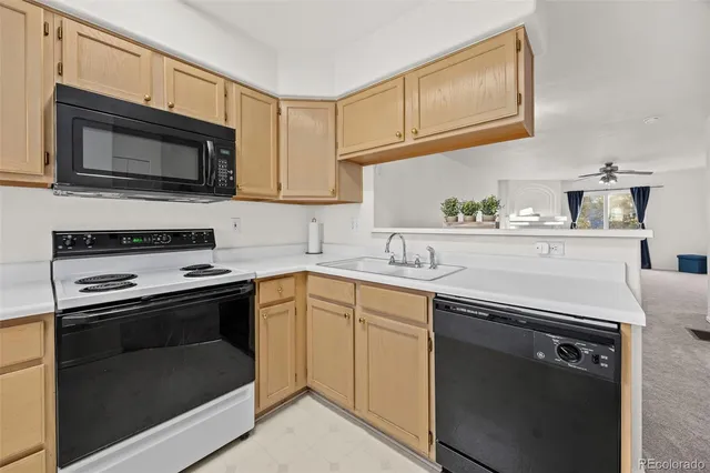 a kitchen with a stove and a microwave