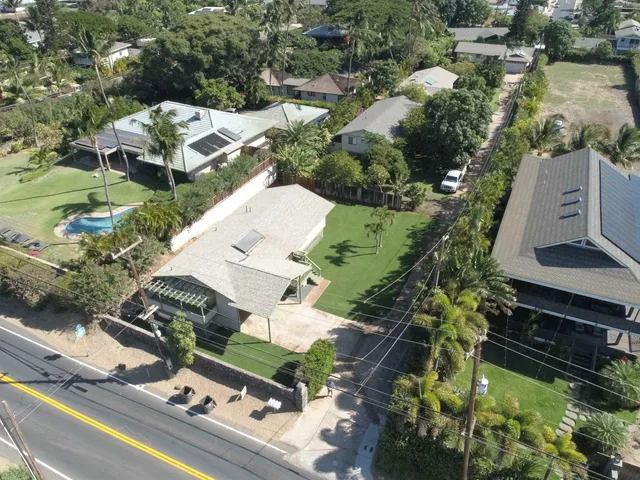 an aerial view of residential houses with outdoor space
