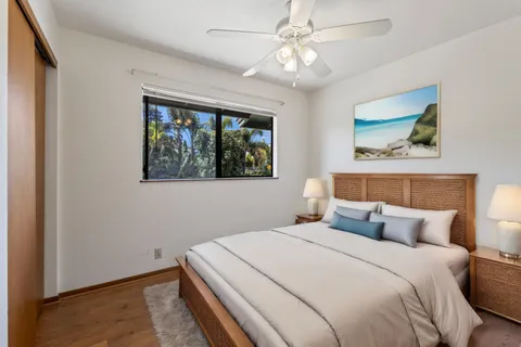 a bedroom with a large bed and a window