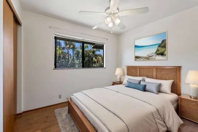 a bedroom with a large bed and a window