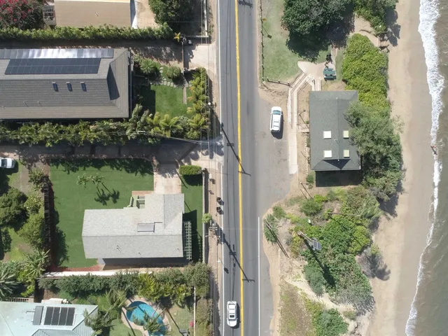 an aerial view of a house with outdoor space