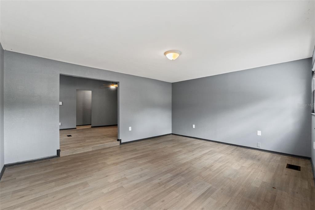 7610 County Road 663 Bushnell, FL 33513 - Photo 22 of 43 a view of an empty room with wooden floor and closet