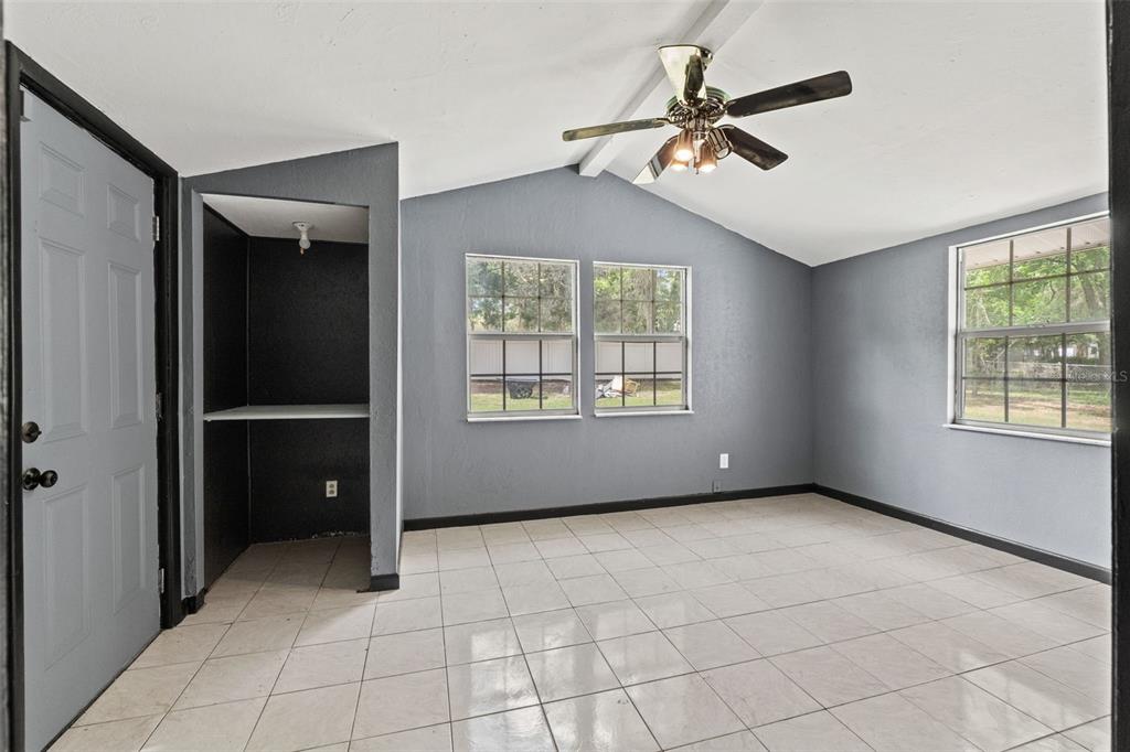 7610 County Road 663 Bushnell, FL 33513 - Photo 27 of 43 a view of an empty room with a window