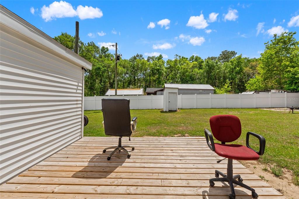 7610 County Road 663 Bushnell, FL 33513 - Photo 29 of 43 a view of a chairs and tables in the patio
