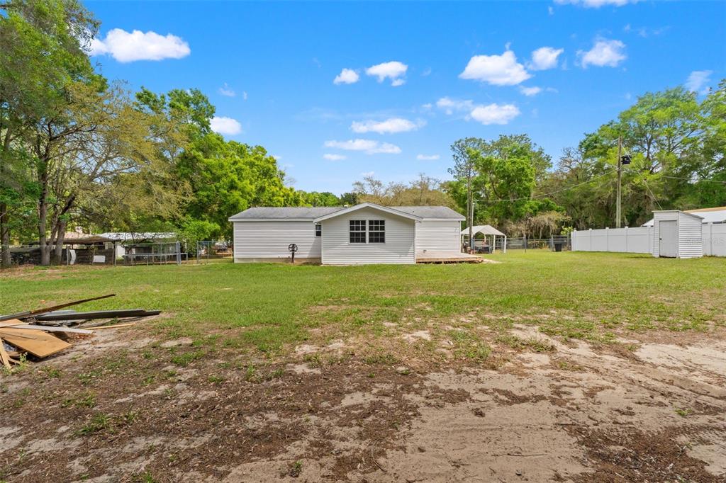 7610 County Road 663 Bushnell, FL 33513 - Photo 32 of 43 a house view with a garden space