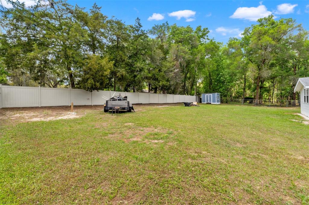 7610 County Road 663 Bushnell, FL 33513 - Photo 33 of 43 a swimming pool with trees in the background
