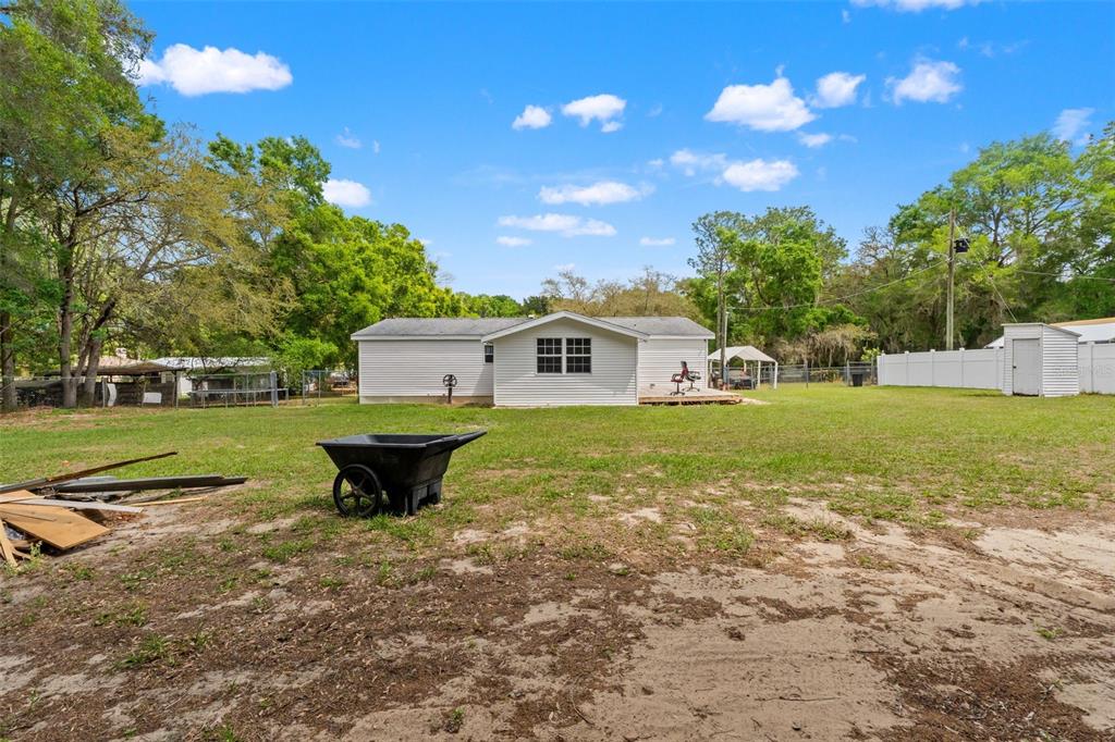 7610 County Road 663 Bushnell, FL 33513 - Photo 34 of 43 a view of a house with a yard