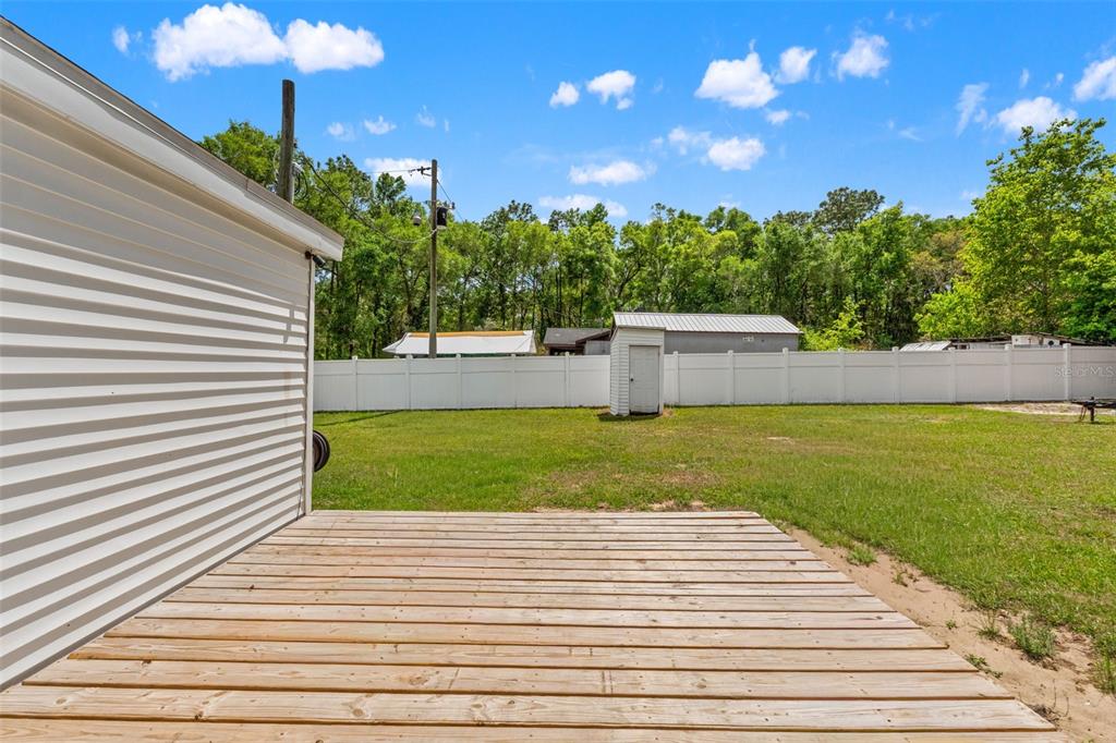 7610 County Road 663 Bushnell, FL 33513 - Photo 38 of 43 a view of a yard with an outdoor space