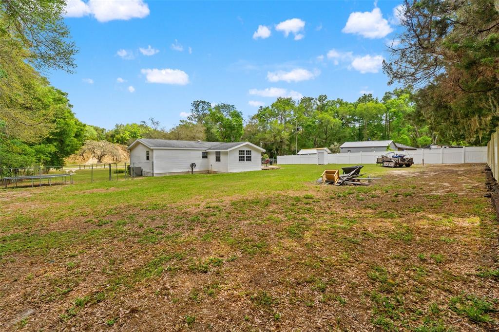 7610 County Road 663 Bushnell, FL 33513 - Photo 39 of 43 a view of a house with outdoor space and sitting area