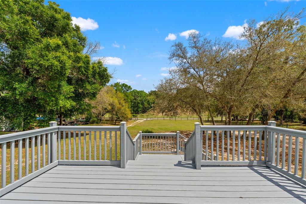 7610 County Road 663 Bushnell, FL 33513 - Photo 5 of 43 a view of a balcony with lake view