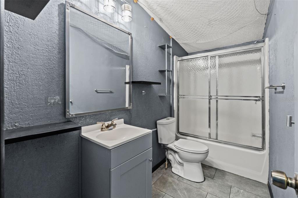 7610 County Road 663 Bushnell, FL 33513 - Photo 10 of 43 a white toilet sitting next to a bathroom sink