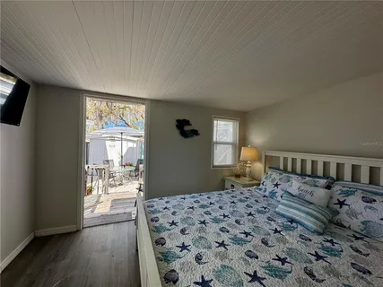 a bedroom with furniture and window