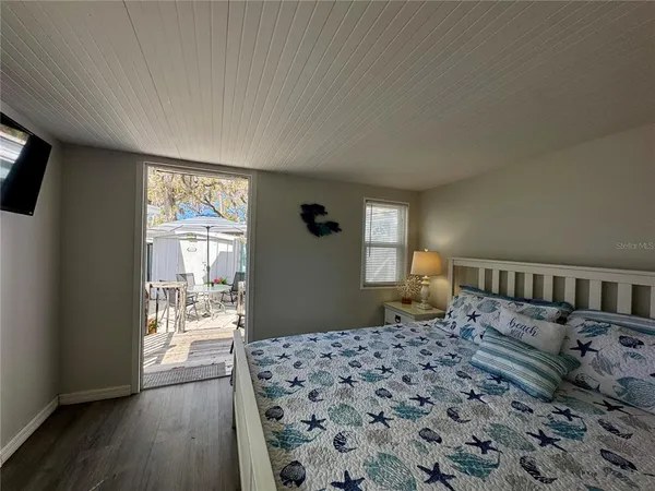 a bedroom with furniture and window