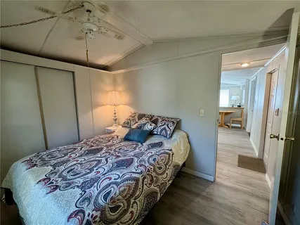 a bedroom with a bed and a walk in closet