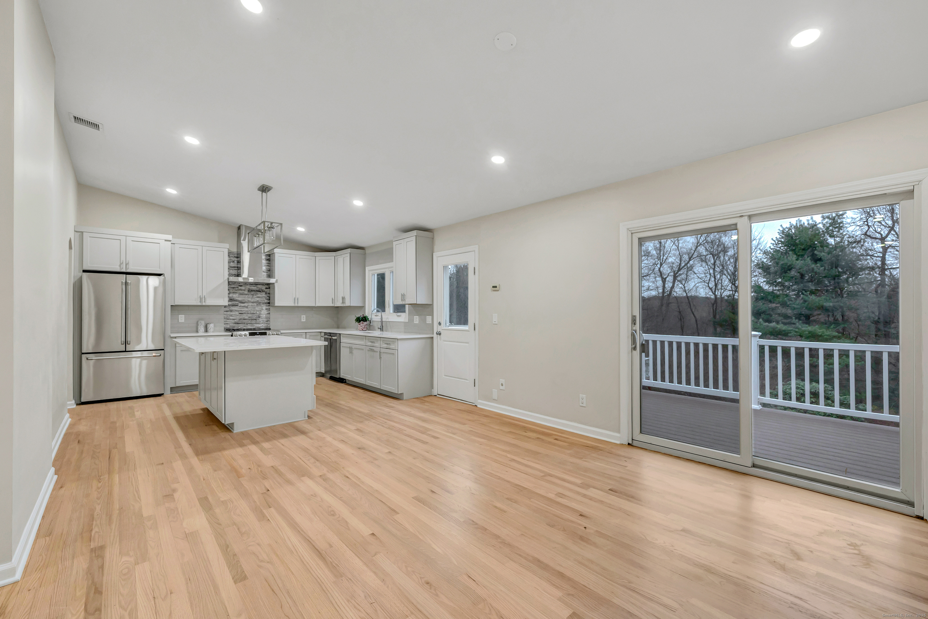 28 Hillside Drive Easton, CT 06612 - Photo 16 of 36 Kitchen and sliders open to new Trex deck