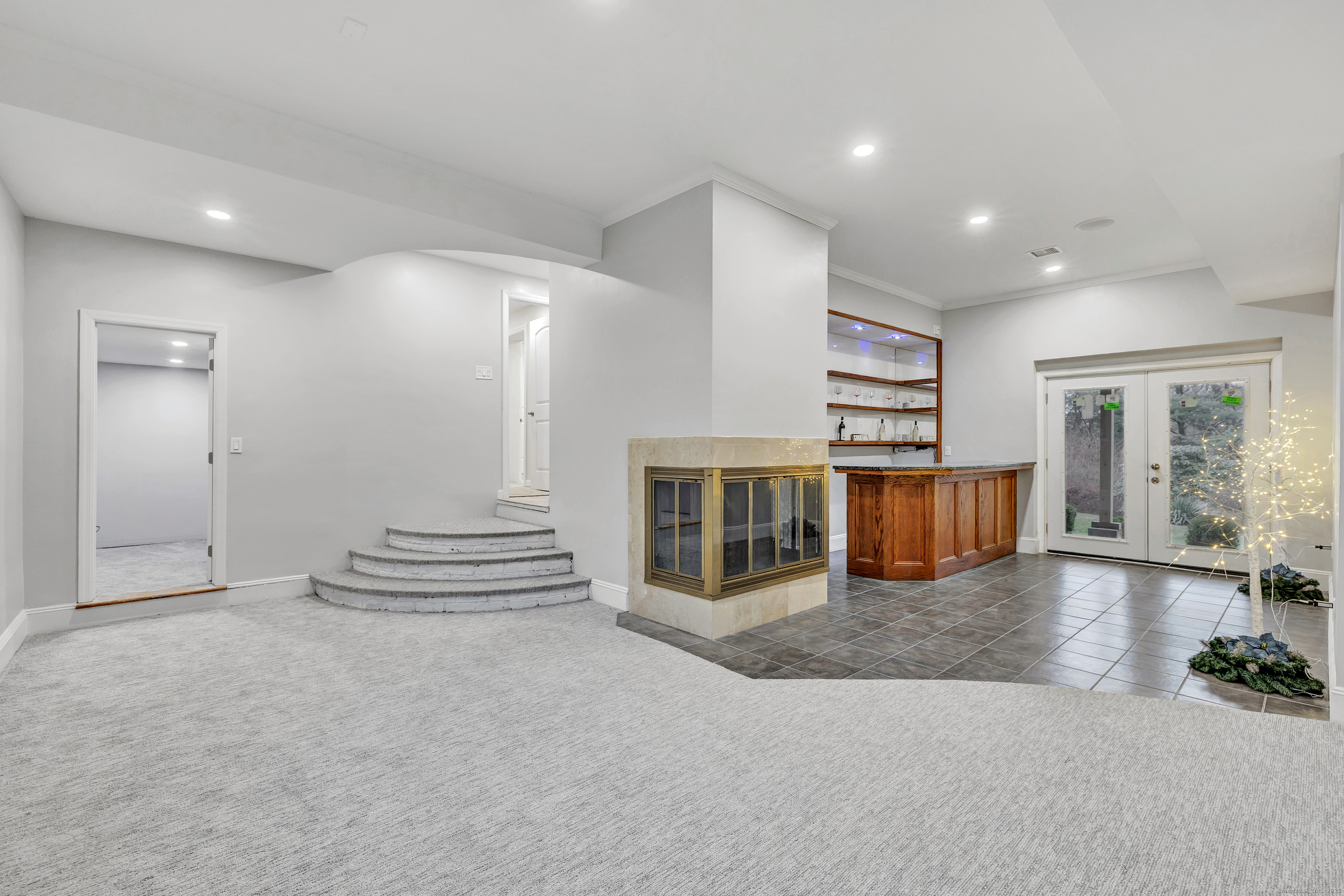 28 Hillside Drive Easton, CT 06612 - Photo 31 of 36 Great room has fireplace, dry bar and rec area with french doors that open to patio