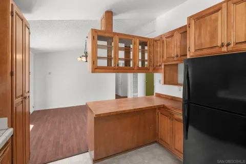 a kitchen with a refrigerator and a sink