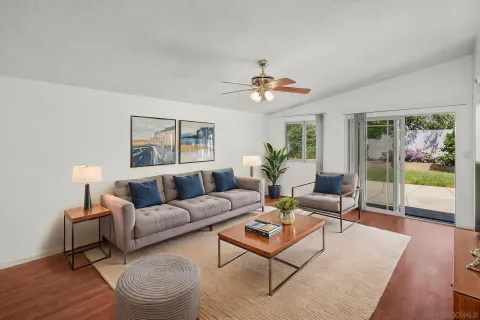 a living room with furniture and a large window