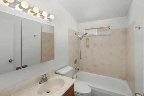 a bathroom with a sink toilet tub and shower
