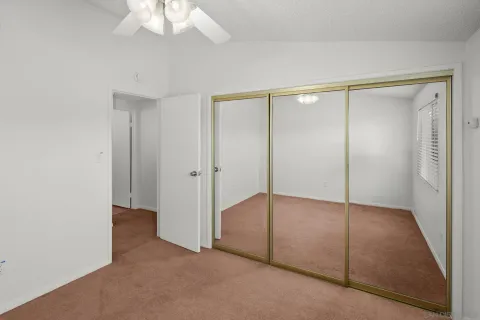 an empty room with fan