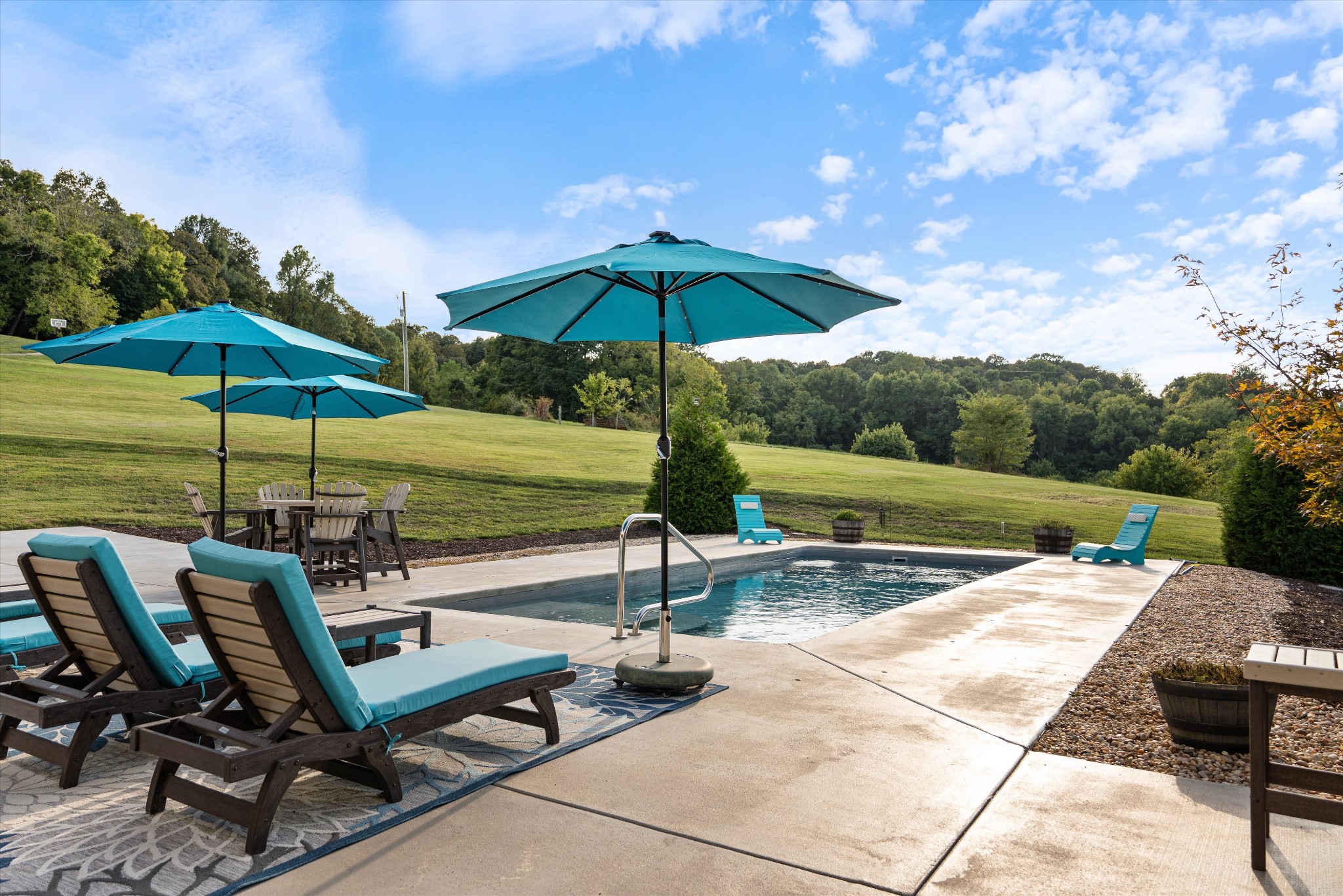 420 Fite Road Watertown, TN 37184 - Photo 67 of 76 a view of a terrace with chairs and umbrella