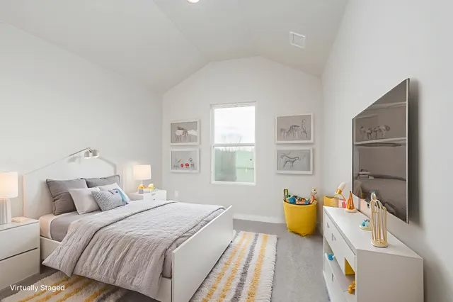 a bedroom with a bed and a table