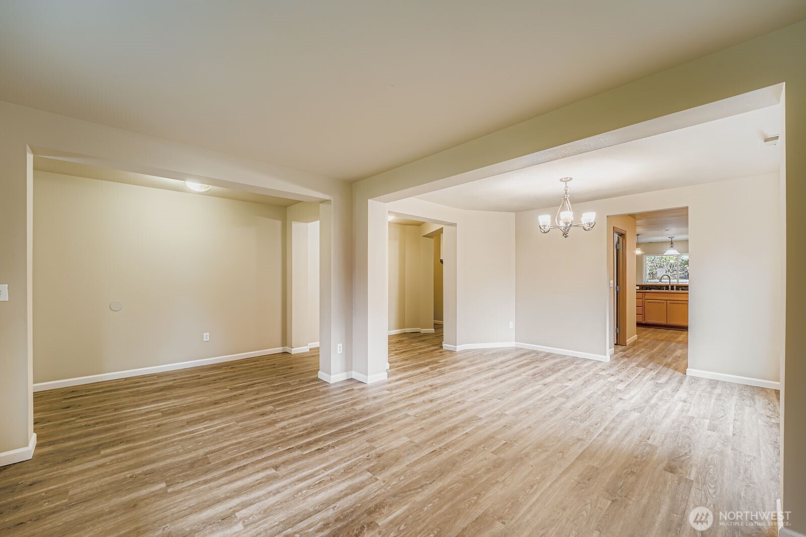 27030 228th Place Southeast Maple Valley, WA 98038 - Photo 14 of 36 a view of an empty room with wooden floor