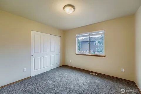 an empty room with a empty space and window