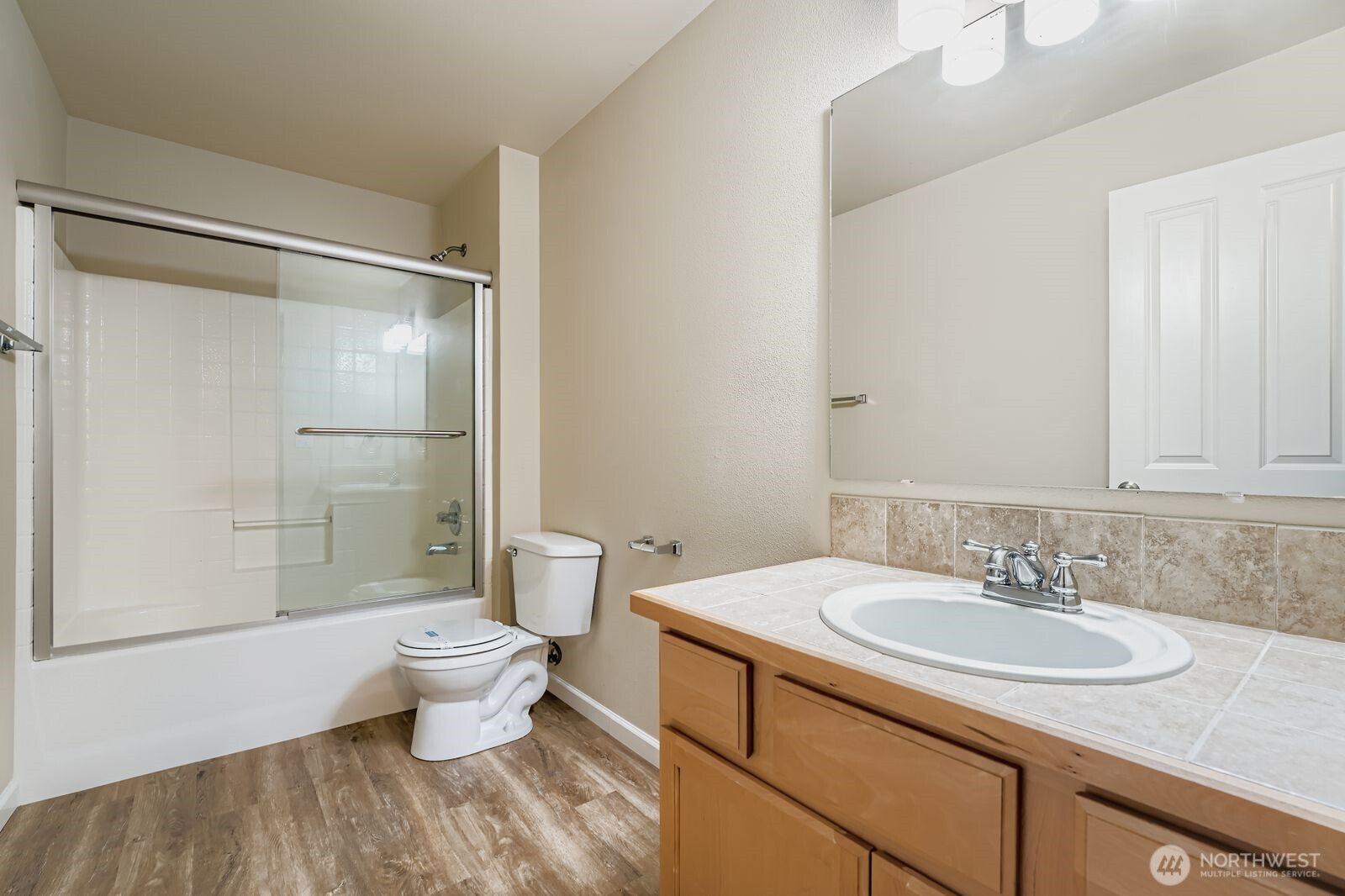 27030 228th Place Southeast Maple Valley, WA 98038 - Photo 26 of 36 a bathroom with a sink toilet and shower