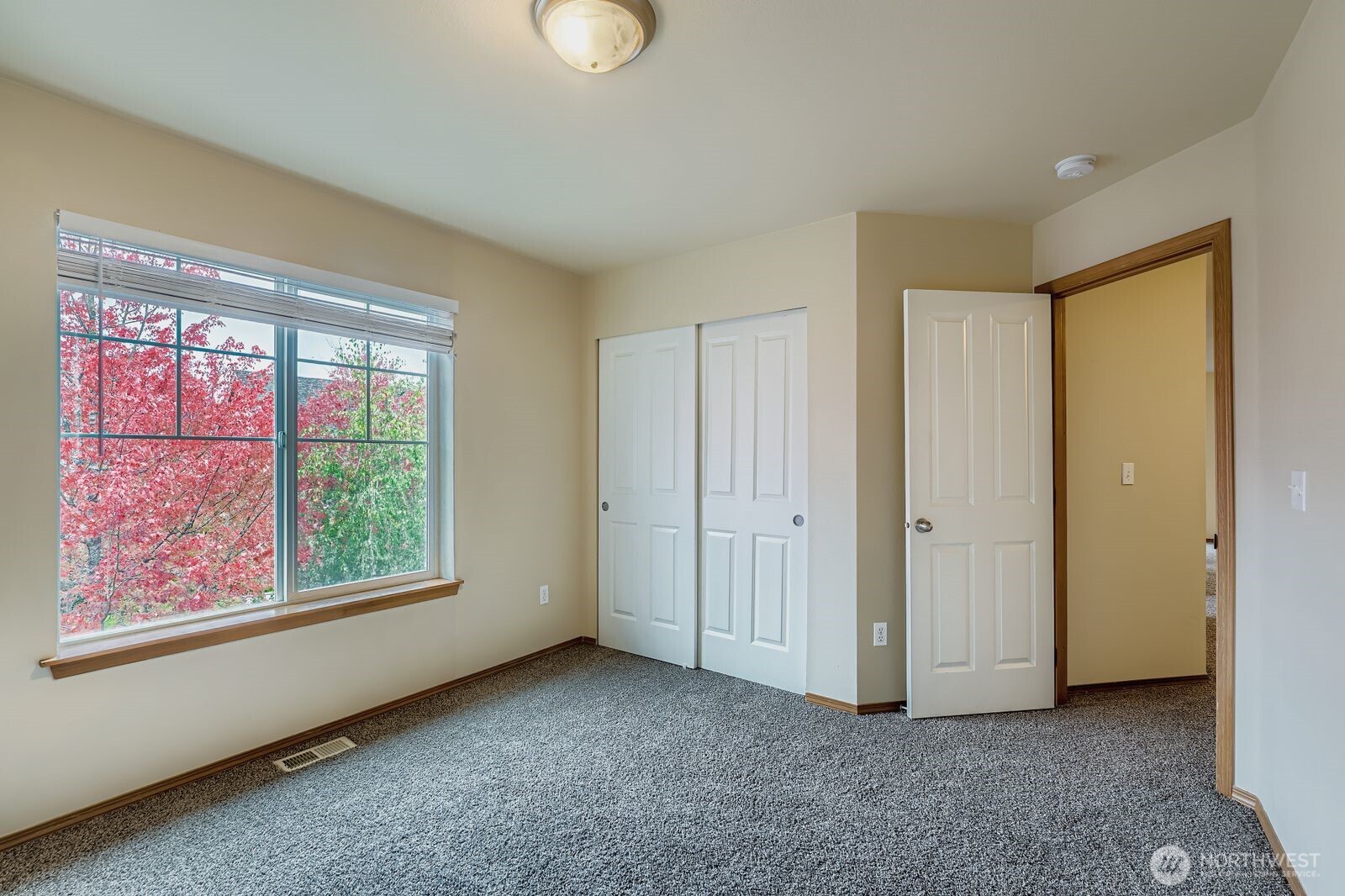 27030 228th Place Southeast Maple Valley, WA 98038 - Photo 27 of 36 a view of an empty room with a window